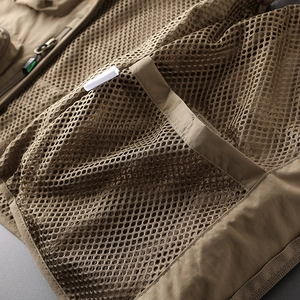 Detail of breathable mesh fabric and reinforced stitching on a khaki tactical vest