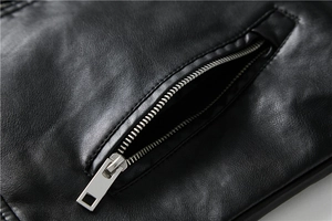 Close-up of black PU leather jacket pocket with high-quality silver metal zipper detail