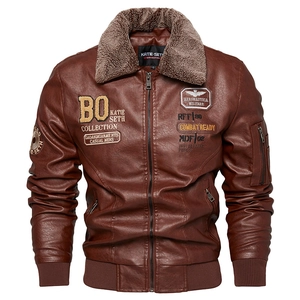 Detail of brown PU leather bomber jacket featuring faux fur collar and military patches