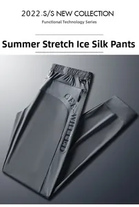 Detail of grey ice silk tech pants showing drawstring waist and breathable mesh panels