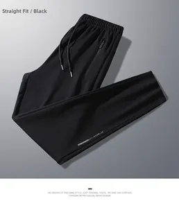 Detail view of black casual pants showing elastic drawstring waist and side zip pocket