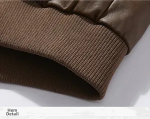 Detail display of the elastic ribbed hem on a brown leather motorcycle jacket for men