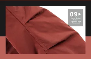 Detail of red-brown tactical jacket sleeve showing pleated elbow design for better movement