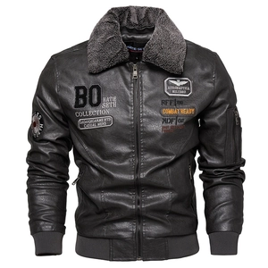 Close-up of the plush faux fur collar and military embroidery on the leather jacket