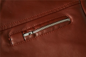 Close-up of high-quality dark red PU leather jacket showing silver metal zipper detail