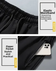 Detail of elastic waistband with drawstring and secure zipper pocket on black joggers
