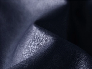 Close-up macro view of premium leather texture on a men's modern motor jacket