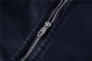 Close-up of durable silver metal zipper on premium black leather motorcycle jacket