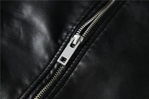 Close-up of premium black PU leather jacket featuring a high-quality silver metal zipper