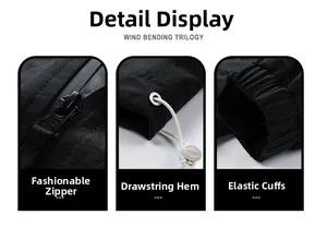 Detail view of black windbreaker featuring ripstop texture and adjustable drawstring hem
