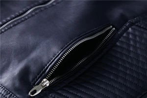 Close-up of high-quality navy blue leather jacket with quilted stitching and metal zipper