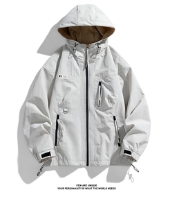 Detailed close-up of techwear jacket with waterproof zippers and adjustable hood