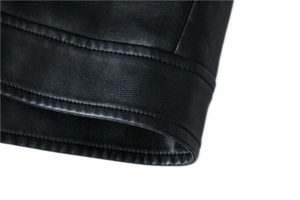 Close-up of premium black PU leather jacket with detailed double stitching and smooth texture