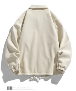 Rear view of cream waffle knit jacket with drawstring hem and elastic cuffs