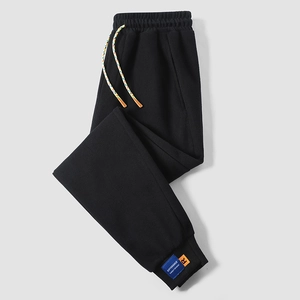 Men's loose black joggers with colorful drawstring and stylish ankle patches