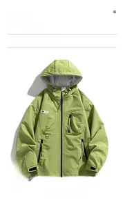 Detail of army green windproof jacket showing hood, zipper pockets and velcro cuffs
