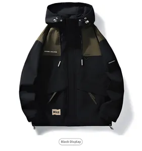 Close-up of black and olive green outdoor jacket featuring adjustable drawstrings and pockets