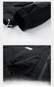 Detail of waterproof zipper, D-ring accessory and ripstop fabric on a men's outdoor jacket