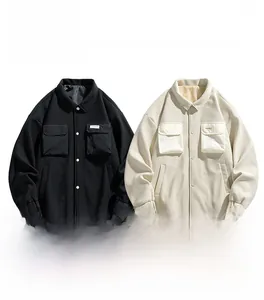 Detail of cargo jacket chest pockets and drawstring hem in black and off-white colors