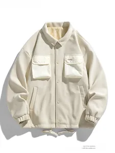 Close-up of beige utility jacket with textured fabric and large chest flap pockets