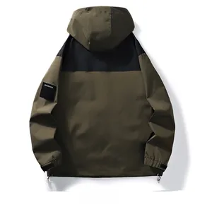 Back view of waterproof outdoor jacket with hood in olive green and black contrast