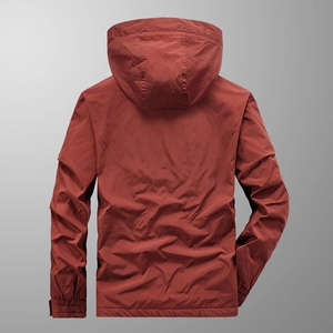Back view of a men's brick red hooded tactical jacket with lightweight ripstop fabric