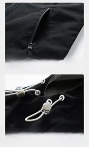 Detail of waterproof black windbreaker featuring zip pockets and adjustable drawstring hood