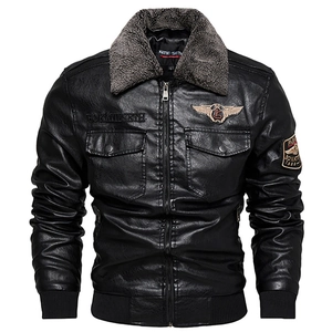 Close-up of men black biker jacket with grey faux fur collar and embroidered patch