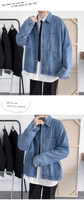 Detailed close-up of light blue vintage denim jacket with lapels and metal buttons