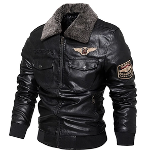 Close-up of black PU leather jacket featuring faux fur collar and embroidered badges