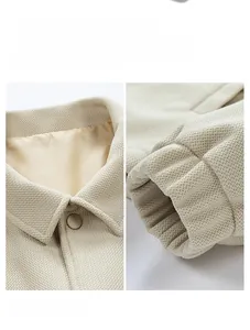 Detail of apricot windproof ribbed cuffs and resin button collar on men casual jacket