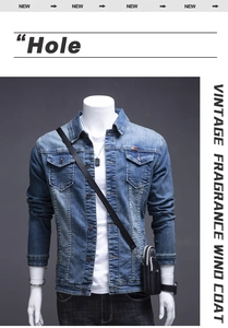 Detail of vintage blue denim jacket featuring chest flap pockets and leather label accent