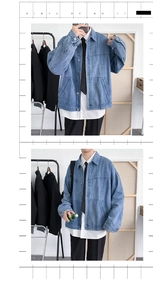 Detail of light blue denim jacket with vintage wash and metal button closures