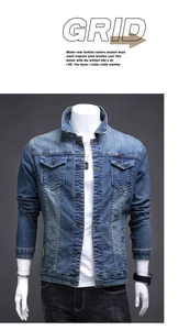 Detail of blue wash denim jacket featuring classic lapel collar and metal button front