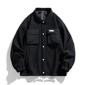 Men's black casual jacket with textured fabric, hooded design and functional pockets