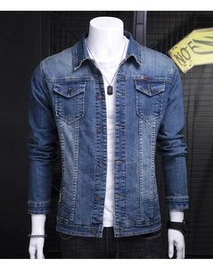 Detailed front view of men's blue denim jacket with double chest pockets and metal buttons
