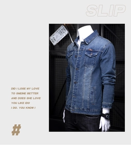 Detailed view of casual blue denim jacket with classic collar and button chest pockets