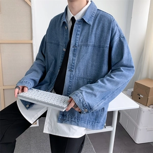 Men's vintage blue denim jacket with lapel collar and relaxed shoulder fit