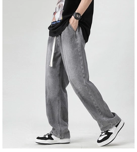 Detail view of washed smoke gray wide-leg jeans with front seam and white drawstring