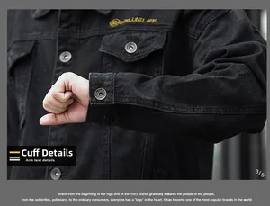 Dettagli del ricamo giallo e bottoni in metallo su una giacca di jeans nera