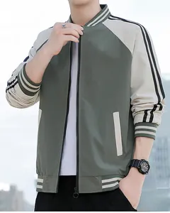 Close-up of olive green bomber jacket with raglan sleeves and striped ribbed cuffs