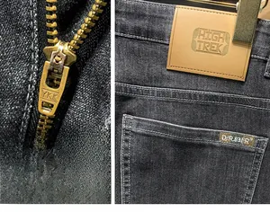 Détails de la fermeture éclair YKK et de l'étiquette en cuir sur ce jean gris foncé pour homme