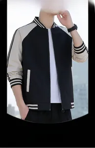 Detail of bomber jacket ribbed cuffs and striped collar in black and beige contrast