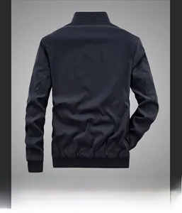 Rear view of navy blue men's reversible bomber jacket with elastic ribbed hem and cuffs