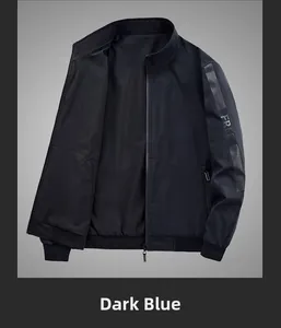 Detail of navy blue reversible jacket featuring FREE embroidery and premium zipper pocket