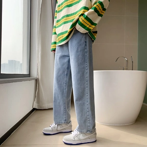 Men's retro light blue wide leg straight jeans with loose fit in a casual minimalist style