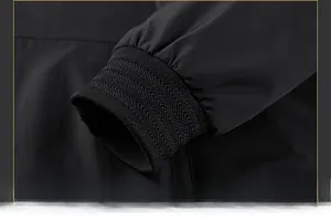 Detailed close-up of ribbed knit cuffs and high-quality stitching on a black casual jacket