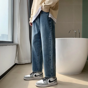 Retro loose straight blue jeans for men with washed vintage finish and casual aesthetic