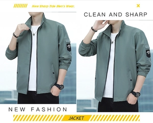 Close-up of greyish green jacket featuring standing collar and sport outdoor sleeve patch