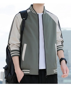 Detail of army green varsity jacket showing ribbed collar, zipper, and pocket accents
